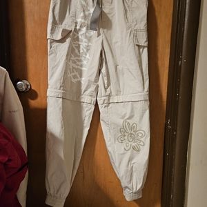 Lightweight, cream colored cargo pants. Zipper on legs to convert to shorts,